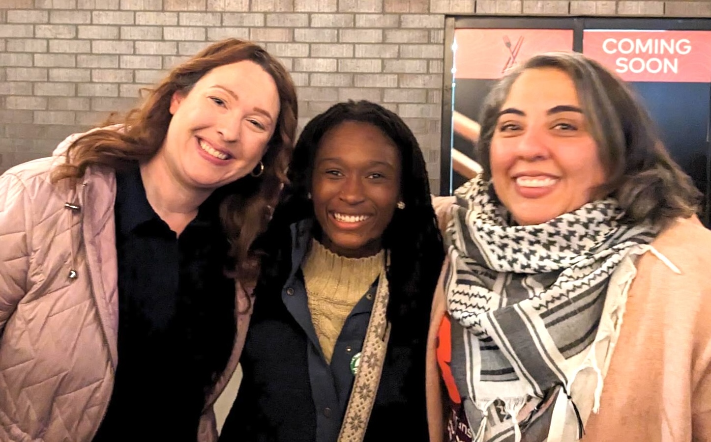Three women smiling